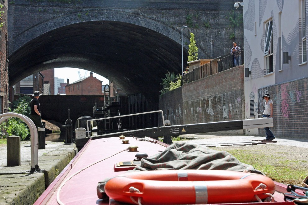 Rising out of lock 13, with, ahead, the huge cavern of Snow Hill railway station bridge and urban scenery in layers.
